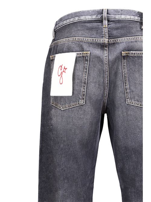 Jeans lavati a gamba larga con toppa Golden Goose | GMP01186P00099490100